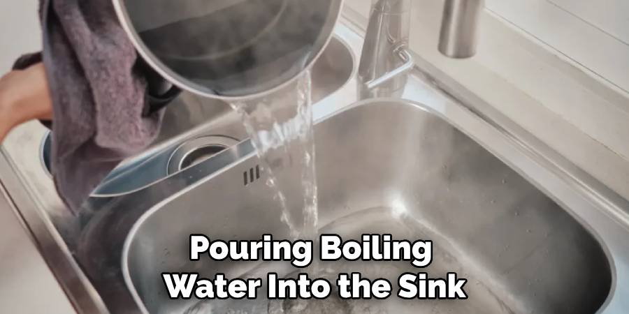 Pouring Boiling Water Into the Sink