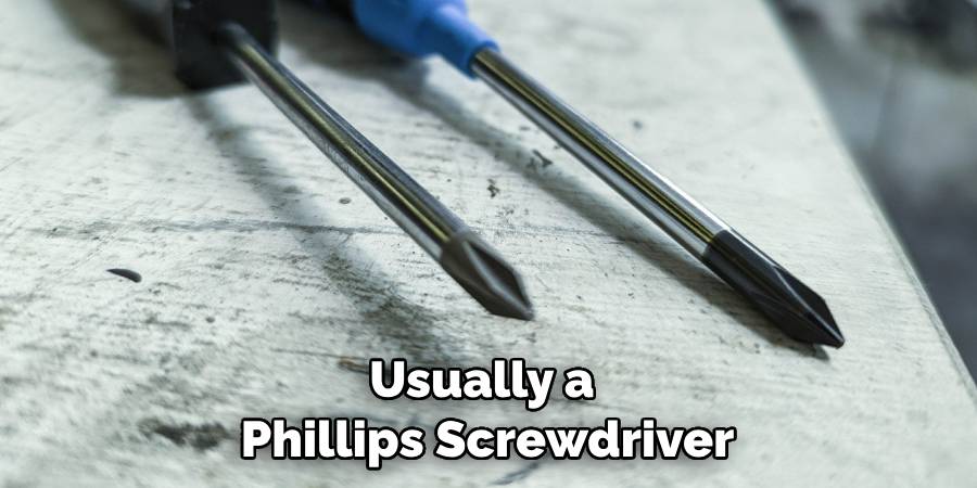 Usually a Phillips Screwdriver