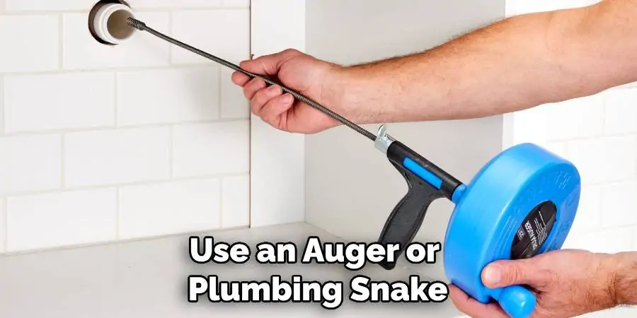 Use an Auger or Plumbing Snake