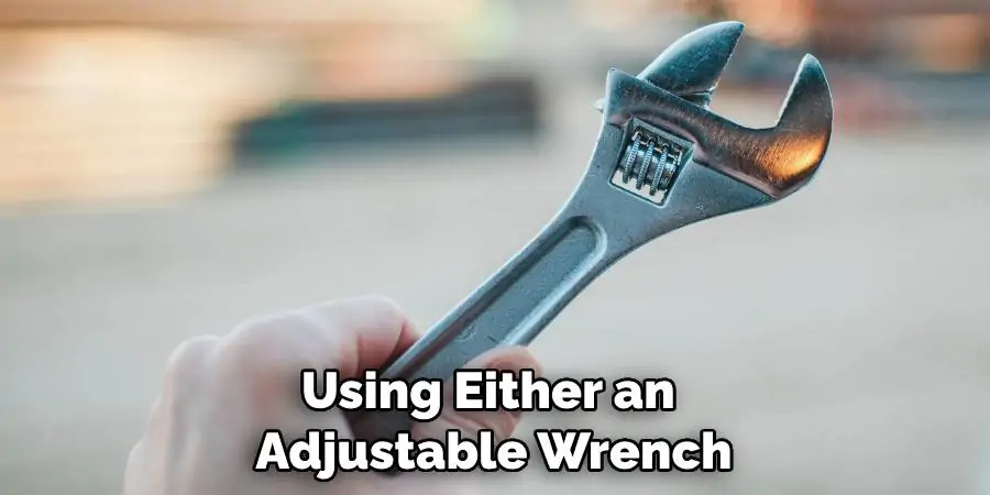 Using Either an Adjustable Wrench